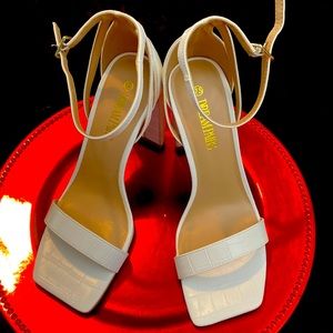 White open-toe heels with ankle straps